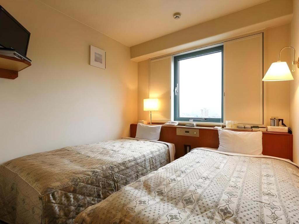 Apa Hotel Nishimaizuruekimae Buitenkant foto